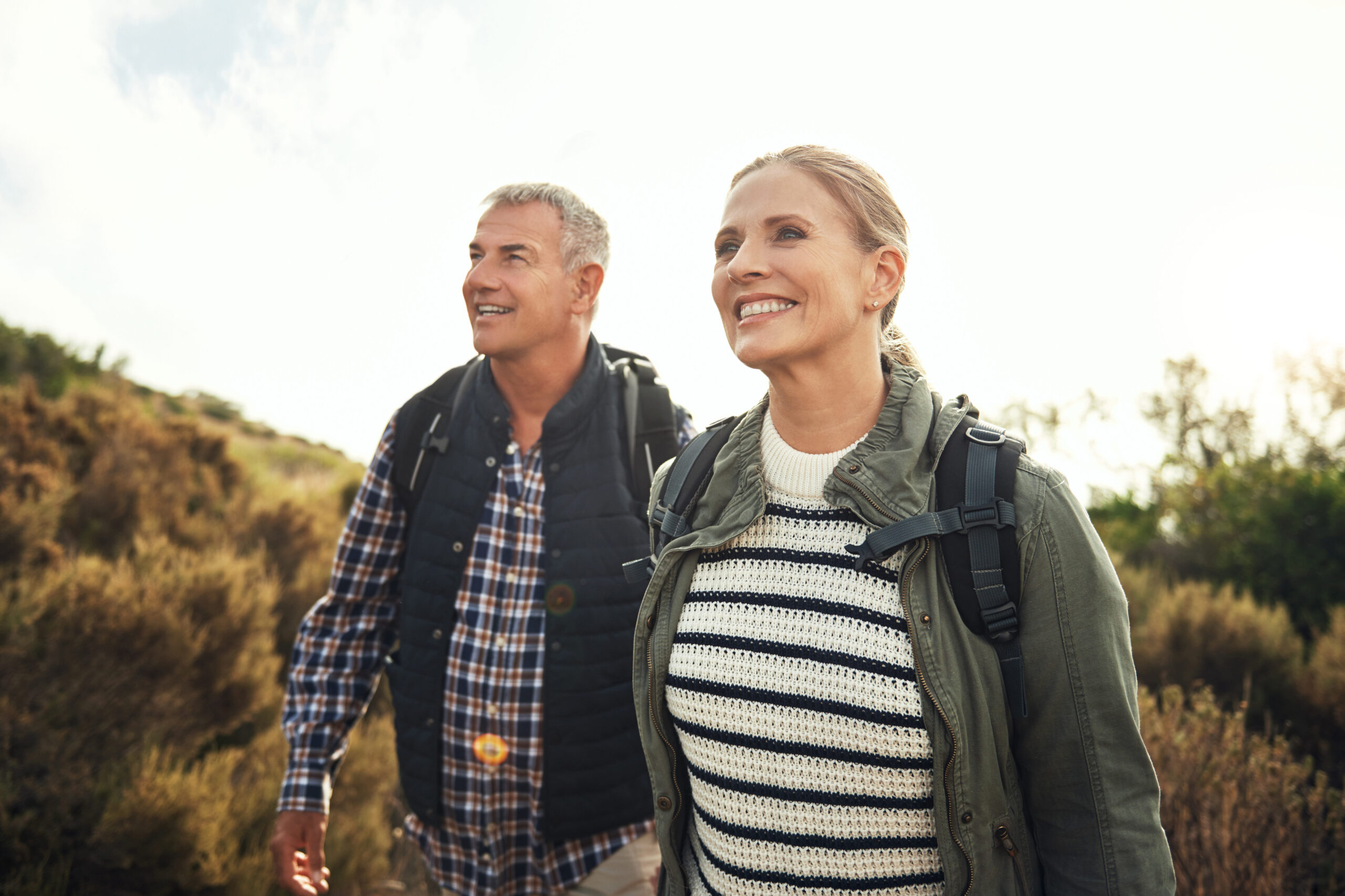Shot of a mature couple hiking through the mountains