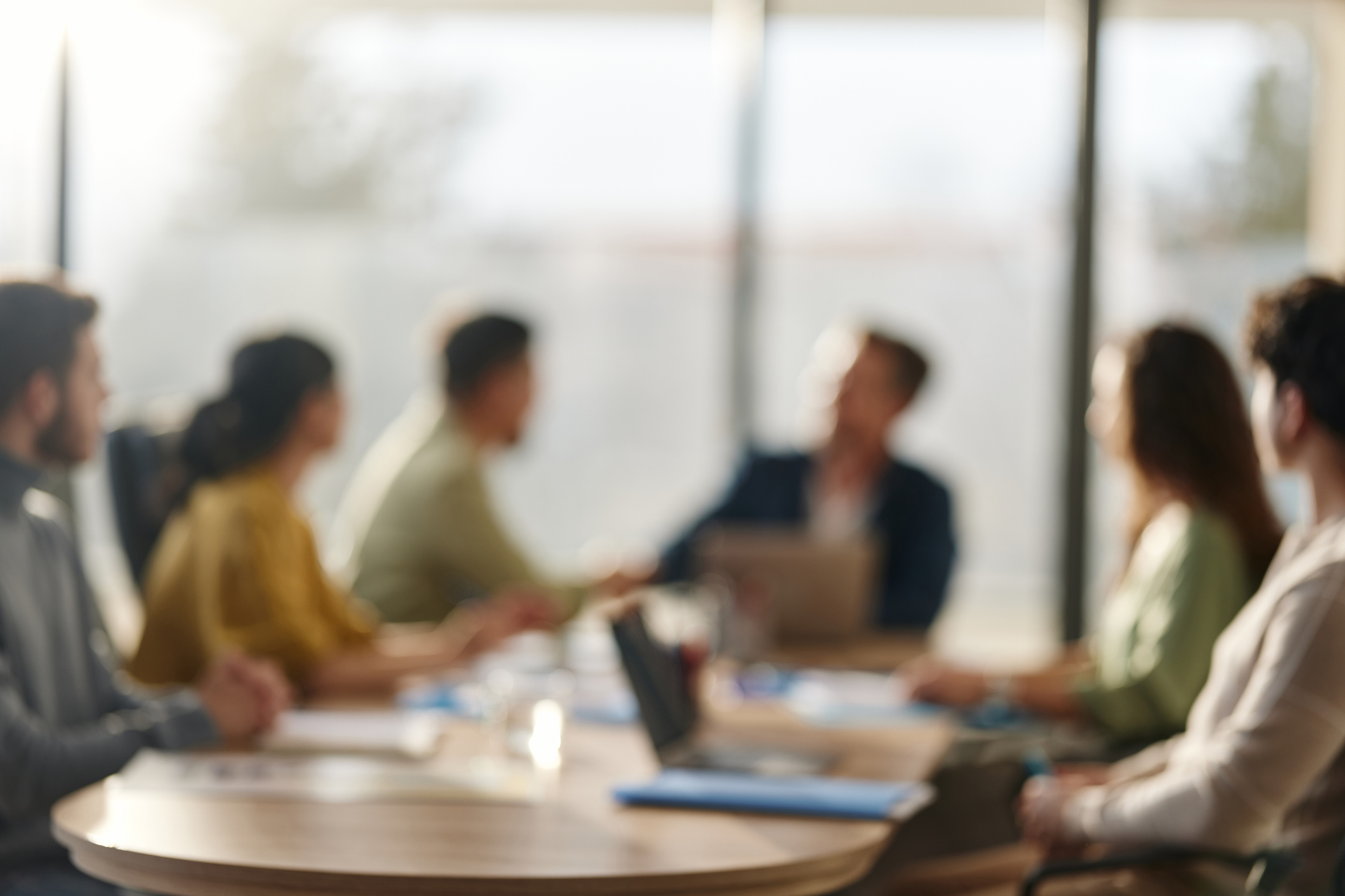 Defocused business meeting background.